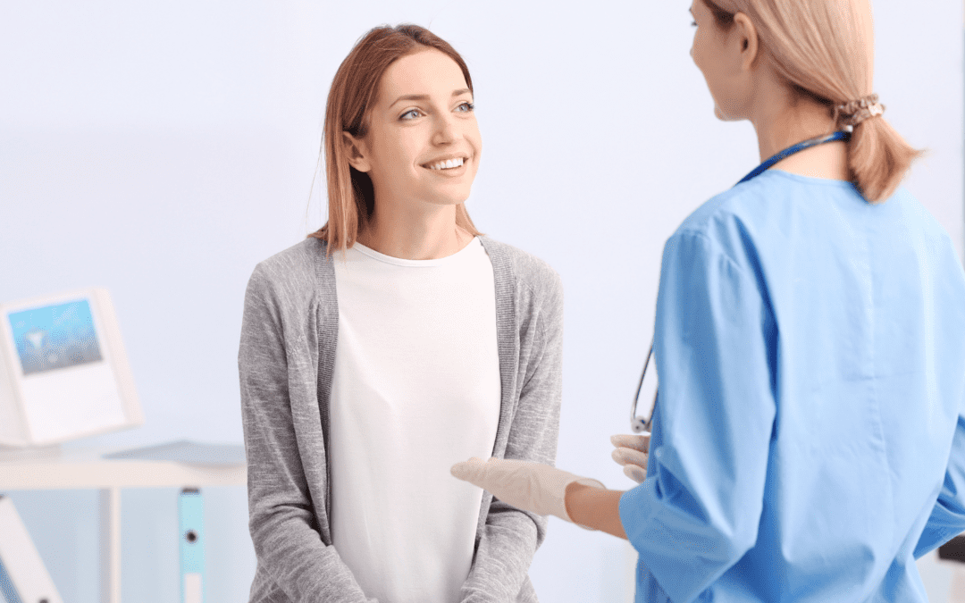 Female patient speaking with nurse