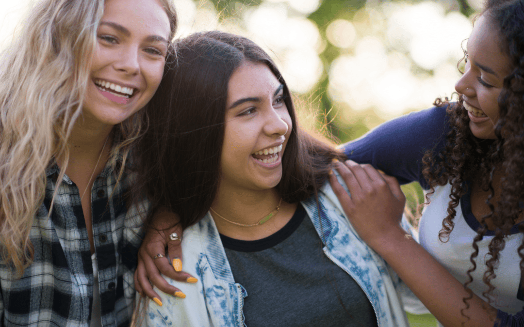 teenage girls smiling and laughing